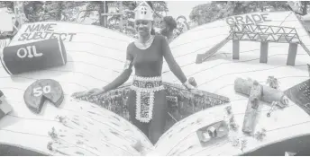  ??  ?? A float depicting the pages of a book highlights the country’s resources and infrastruc­ture at the Children’s Costume and Float Parade (Rae Wiltshire photo)