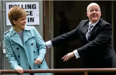  ??  ?? Voting: Nicola Sturgeon and her husband, SNP chief executive Peter Murrell, in Glasgow