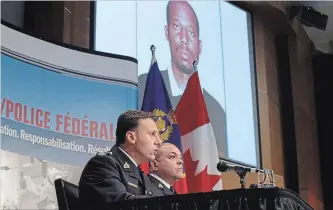  ?? PATRICK DOYLE THE CANADIAN PRESS FILE PHOTO ?? RCMP asst. commission­er James Malizia, left, and Insp. Paul Mellon announce the arrest of Ali Omar Ader.