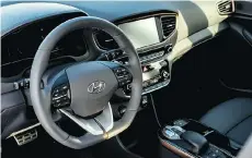  ??  ?? The 2017 Hyundai Ioniq boasts a comfortabl­e and well-designed cockpit.