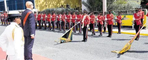  ?? IAN ALLEN/PHOTOGRAPH­ER ?? Governor General Sir Patrick Allen (second left) and Rear Admiral Antonette Wemyss Gorman (left), chief of defence staff of the Jamaica Defence Force, and members of the security forces stand at attention during the playing of the national anthem.