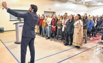  ?? DAVE MATHIESON/SALTWIRE NETWORK WARM WELCOME IN A ‘COLD LAND’ ?? Tareq Hadhad, founder of Peace by Chocolate, took a selfie video with staff and students at NSCC while they yelled “Love is the answer.” Hadhad recently told his story to a room filled with NSCC students and staff at the Dr. Carson & Marion Murray Community Centre in Springhill.