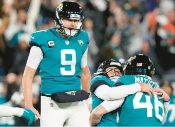  ?? CHRIS O’MEARA/AP PHOTOS ?? Jaguars kicker Riley Patterson (center) celebrates his winning and game-ending 36-yard field goal with holder Logan Cooke (9) and long snapper Ross Matiscik (46) against the Los Angeles Chargers in an AFC wild-card game on Saturday night in Jacksonvil­le.