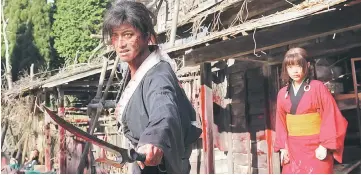  ?? — Photo courtesy of Magnet Releasing ?? Manji (Takuya Kimura) offers Rin (Hana Sugisaki) protection and a chance at vengeance in the blood-filled “Blade of the Immortal.”