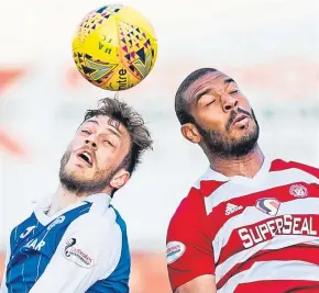  ?? Pictures: SNS Group. ?? Top: David McMillan scores St Johnstone’s opener from the penalty spot and then celebrates with team-mates, right; above: Murray Davidson challenges Accies Marios Ogkmpoe for a high ball.