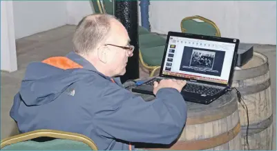  ?? 25_c17coalmin­ining03 ?? Jan’s husband, Paul Barham, has been her ‘rock’ during preparatio­ns for the exhibition. He is seen here altering slide show timings.