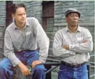  ?? WARNER HOME VIDEO ?? Andy (Tim Robbins, left), and Red (Morgan Freeman) survey the prison yard of “The Shawshank Redemption,” which turned 25 this month.