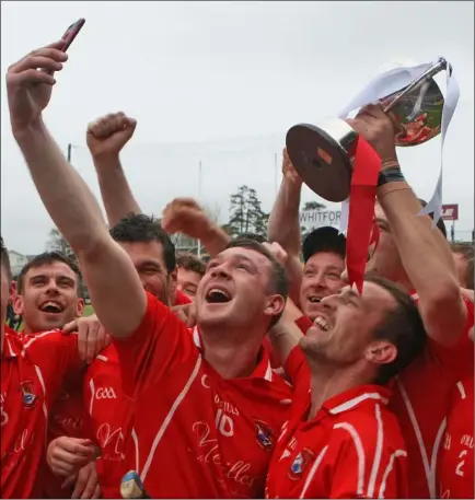  ??  ?? Eddie Power takes a selfie with his Fethard colleagues and their new arrival, the Leinster Junior hurling championsh­ip trophy, after their impressive win over John Lockes (Kilkenny) in Innovate Wexford Park on Saturday. SEE PAGE 49 Selfie time for the...