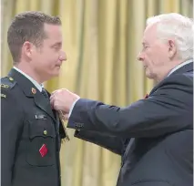  ?? ADRIAN WYLD/THE CANADIAN PRESS ?? Warrant Officer Jason Pawsey, left, was one of 23 military personnel to receive the Meritoriou­s Service Cross from Gov. Gen. David Johnston during a ceremony at Rideau Hall.