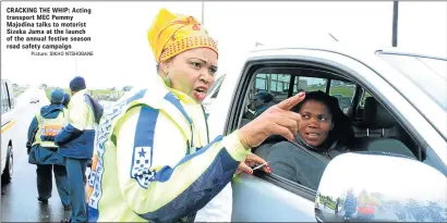  ?? Picture: SIKHO NTSHOBANE ?? CRACKING THE WHIP: Acting transport MEC Pemmy Majodina talks to motorist Sizeka Jama at the launch of the annual festive season road safety campaign