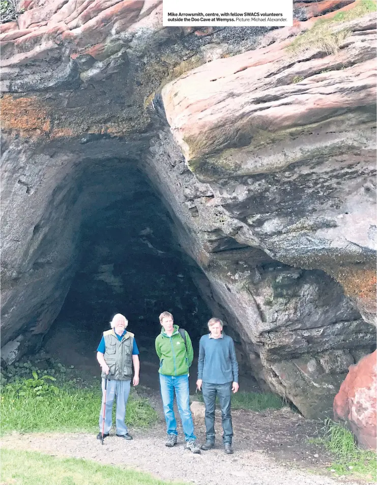  ?? Picture: Michael Alexander. ?? Mike Arrowsmith, centre, with fellow SWACS volunteers outside the Doo Cave at Wemyss.