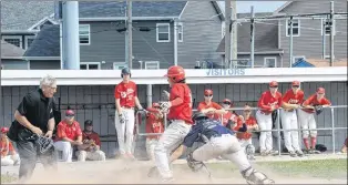  ?? JOE GIBBONS/THE TELEGRAM ?? Mount Pearl Blazers catcher Nick French applies the tag to the St. John’s Capitals’ Daniel Rice at home plate as Rice attempted to score on a fielders choice play during the fourth inning of their preliminar­y-round game in the provincial junior...