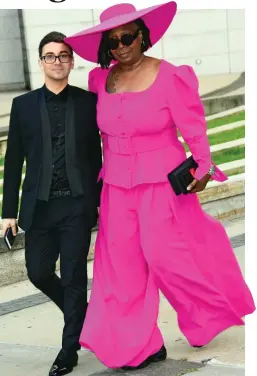  ??  ?? Hot pink: Miss Goldberg and designer Christian Siriano