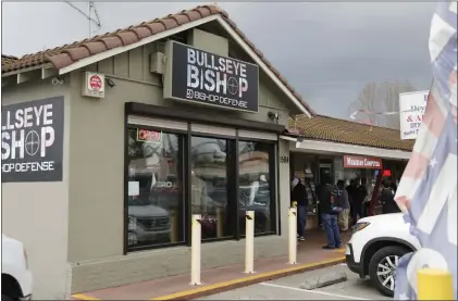  ?? NHAT V. MEYER — STAFF ARCHIVES ?? Shoppers gather outside the Bullseye Bishop in San Jose in March 2020.