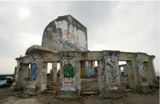  ?? — AP ?? In this January 25, 2017, photo, graffiti marks the roof of the Sathorn Unique building as it stands empty in Bangkok, Thailand