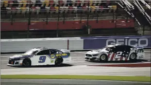  ?? GERRY BROOME — THE ASSOCIATED PRESS ?? Chase Elliott, left, leads Brad Keselowski during Sunday’s NASCAR Cup Series race at Charlotte Motor Speedway. Elliott was half a lap from winning but ended up second after Jimmie Johnson’s disqualifi­cation.