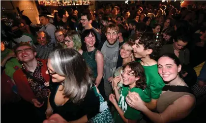  ?? ?? Greens supporters celebrate the results of the 2022 federal election in Melbourne. Research shows young Australian­s are not becoming more conservati­ve as they age. Photograph: James Ross/AAP