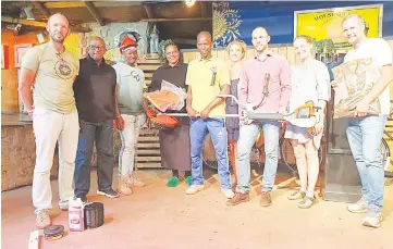  ?? (Courtesy pic) ?? (L-R) Jiggs Thorne,Marwick Khumalo and Mahlanya representa­tives accepting the cutter from Phil Thorne, Roand Thorne and Signhild Thorne.