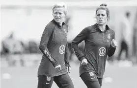  ?? Kirsty Wiggleswor­th / Associated Press ?? Veterans Megan Rapinoe, left, and Kelley O’Hara train together in London. O’Hara said the tournament field has become more competitiv­e.