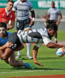  ?? Photos: World Rugby ?? Fiji Airways Fijian men’s sevens rover Manueli Maisamoa scores a try against Uruguay at the Dubai Sevens on December 3, 2022.