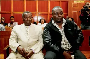  ?? Reuters ?? Kenya’s National Olympic Committee vice-chairman Pius Ochieng (R) and secretary general Francis Paul sit inside the Milimani Law court in Nairobi. —