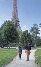  ?? ALISON OSHEL ?? Alison Oshel’s husband and sister walk in a nearly vacant Champs de Mars in Paris.