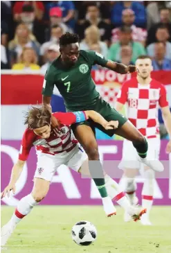  ?? Photo: Getty Images ?? Croatia's Luka Modric (L) and Nigeria's Ahmed Musa in a 2018 FIFA World Cup Group D match at Kaliningra­d Stadium. Croatia won 2-0