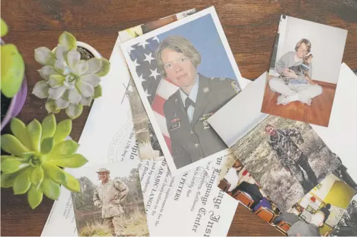  ?? PATRICK SEMANSKY/AP ?? Photos of Julie Akey during her time at Ford Ord on a table at her home in Herndon, Va. What she didn’t know while working at the military base was that the ground under her feet and the water that ran through the sandy soil were polluted with a cancer-causing class of chemicals.