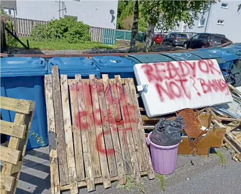  ?? ?? MESS: The fly-tipping – complete with a Banksy reference – appeared on Miller Road in Oban over the weekend.