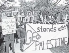  ?? ?? Standing with terrorists: Students protest outside the University of Michigan president’s home after he condemned Hamas’ massacre.