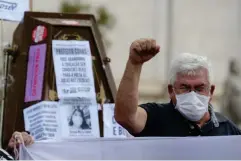  ??  ?? A man gestures as he takes part in a protest against Sao Paulo's mayor Bruno Covas, the state’s governor Joao Doria and Bolsonaro for their mismanagem­ent of Covid-19 (Reuters)