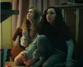  ??  ?? Olivia Scott Welch, left, and Kiana Madeira in the Netflix horror movie "Fear Street: Part One — 1994."