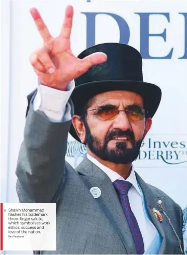  ?? Rex Features ?? Shaikh Mohammad flashes his trademark three-finger salute, which symbolises work ethics, success and love of the nation.