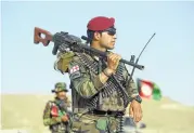  ?? Rahmut Gul / Associated Press ?? Army soldiers stand guard Monday at a checkpoint in Kabul, Afghanista­n.