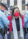  ?? ALYSSA POINTER/ATLANTA JOURNAL CONSTITUTI­ON ?? State Representa­tive Park Cannon is arrested Thursday by Georgia state troopers at the state Capitol in Atlanta.