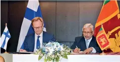  ??  ?? From right: Telecommun­ication and Digital Infrastruc­ture Ministry Secretary Wasantha Deshapriya and Finland Economic Affairs and Employment Deputy Minister Petri Peltonen sign the MOU on digitaliza­tion