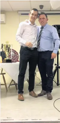  ??  ?? AFC Llwydcoed Welsh league manager Craig Boulton presents Andy Hargreaves with his award for 100% appearance­s for the club’s Welsh League Division 2 team