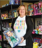  ?? CONTRIBUTE­D ?? Shelly Calvert of Troy holds some of the gifts donated for children whose birthdays are celebrated at parties byWe Love Birthday Parties.