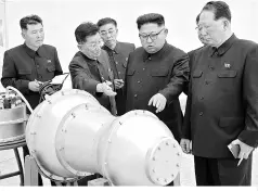  ?? PHOTO: REUTERS ?? The actions of Kim Jong Un (second from right) are set to further increase tensions in the region, where concerns have grown that a war of words between US President Donald Trump and N Korea’s supreme leader could set off a military conflict