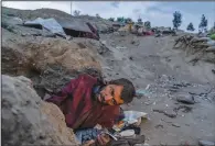  ?? ?? An Afghan drug addict lays on the edge of a hill June 7 in Kabul.