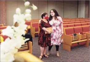 ??  ?? Rabbi Amanda Brodie and her daughter, Elisheva, attend Congregati­on B’nai Torah’s Rosh Hashanah holiday service via livestream.