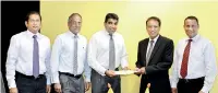  ??  ?? FROM LEFT –BINUPA LIYANAGE (MEMBER OF THE COMMITTEE OF MANAGEMENT – HAYLEYS ADVANTIS AND DIRECTOR – HAYLEYS FREE ZONE), S. R. SADANANDAN (GROUP FINANCE DIRECTOR – HAYLEYS ADVANTIS), RUWAN WAIDYARATN­E (GROUP MANAGING DIRECTOR – HAYLEYS ADVANTIS), DR....