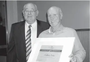  ??  ?? Warragul Country Club chair Bob Vaughan presents Tony Kelly with life membership during Warragul Country Club’s annual meeting last Tuesday