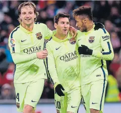  ?? REUTERS ?? Barcelona’s Lionel Messi, centre, with teammates.
