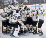  ?? TREVOR HAGAN — THE CANADIAN PRESS VIA AP ?? The Vegas Golden Knights mob goaltender Marc-Andre Fleury (29) after defeating the Winnipeg Jets during NHL Western Conference Finals, game 5, in Winnipeg, Sunday.