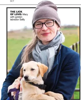  ?? ?? THE LICK OF LOVE: Mary with golden labrador Saffy