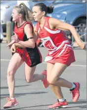  ??  ?? INTENSE: Stawell wing attack Tarnee Orr and Ararat wing defence Harmony Newman tangle in a fight for the ball during a Good Friday clash. Picture: PAUL CARRACHER