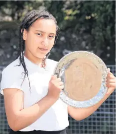  ??  ?? Salver success P6 pupil Esosa Airhumwund­e was awarded the Cameron Community Salver