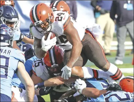  ?? John Kuntz/ Cleveland.com ?? Cleveland Browns running back Nick Chubb leaps over the lineman for a touchdown rush in the first half, December 6, 2020, at Nissan Stadium.