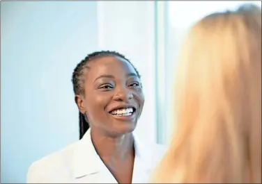  ?? Adventheal­th Gordon ?? Dr. Pelumi Adedayo of AdventHeal­th Medical Group speaks with a patient during an appointmen­t.